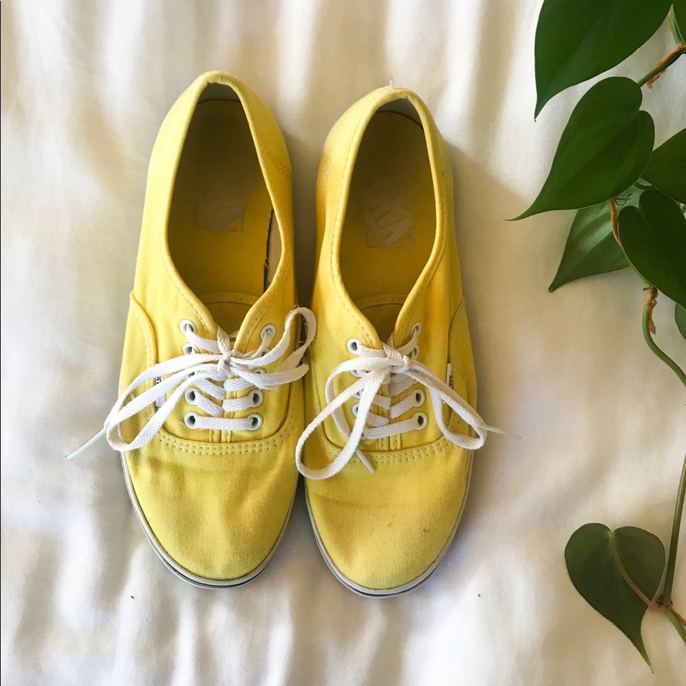 Yellow Vans tennis shoes